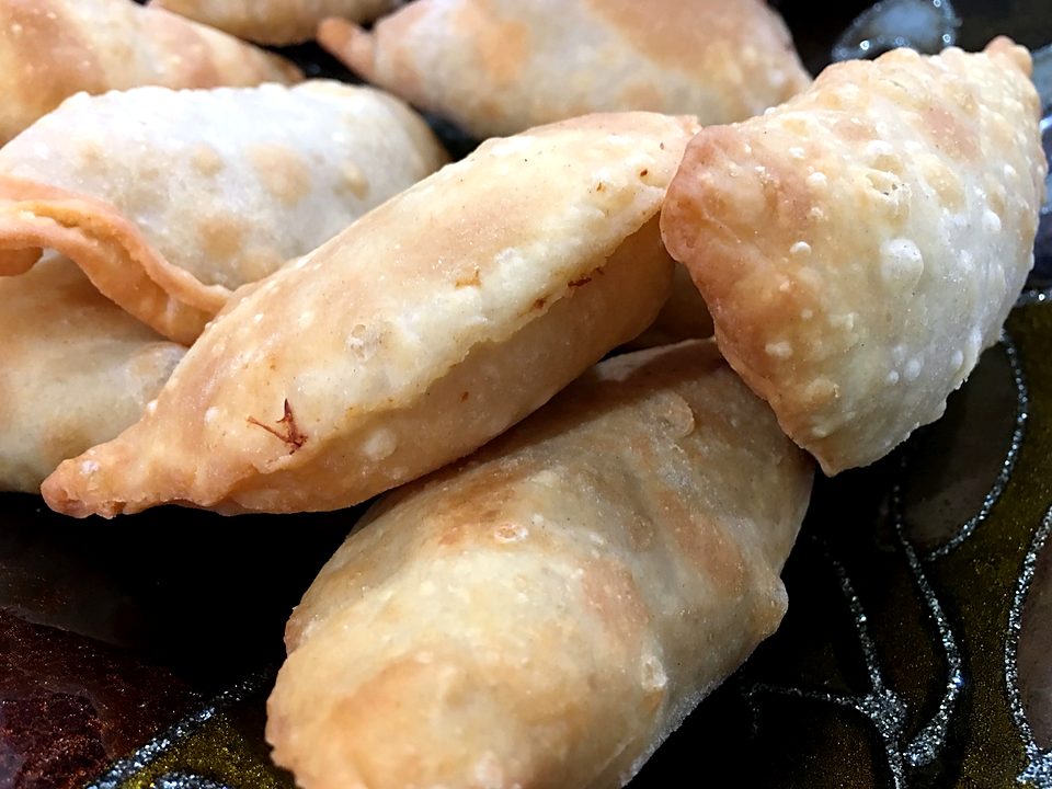 Close-up of golden fried chicken empanadas